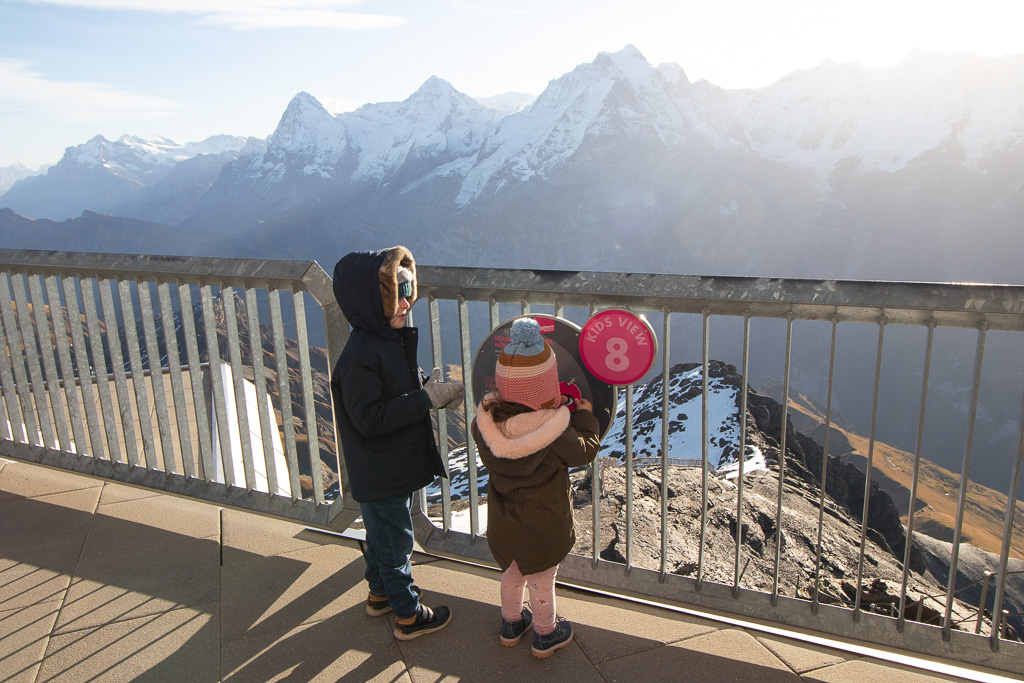 Kids looking at Swiss Alps from Schilthorn, Switzerland